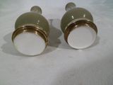 two salt and pepper shakers sitting on a table