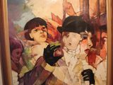 a picture of a painting on the wall above a toilet