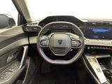 a picture of the interior of a car with a steering wheel and dashboard