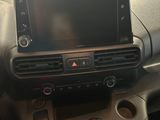 a picture of a car dashboard with a phone in it