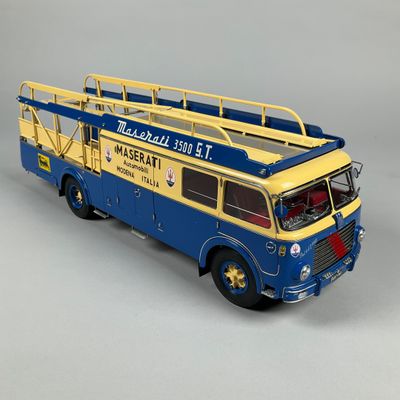 a blue and yellow fire truck with a ladder on it