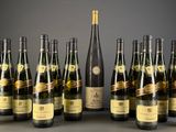 several bottles of wine are lined up on a table