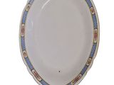 an image of a white plate with blue and gold trim