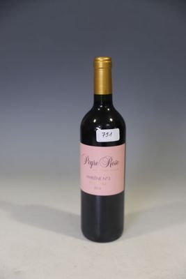 a bottle of wine that is sitting on a table