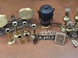 a lot of antique brass items on the table