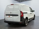 the rear end of a white van parked in a large room