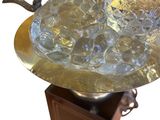 a glass bowl on a stand with a glass bowl on it