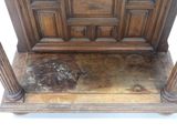 a very old wooden bed with a stone floor underneath it