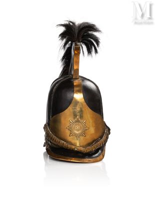 an old helmet with a feather on top of it on a white surface