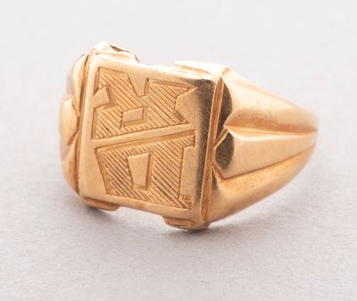 an image of a gold ring with a design on it