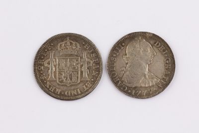 two silver coins with the image of a man and a woman on them