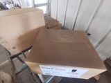 boxes are stacked on top of a carton in a warehouse