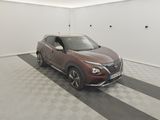 a car that is parked in a room with a checkered floor