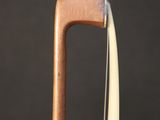 a close up of a violin ' s neck with a string attached to it