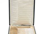 a black case with a bunch of silver spoons in it