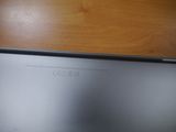 a laptop that is sitting on a wooden table