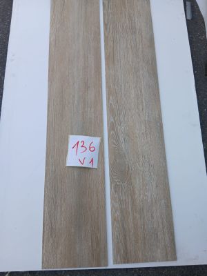 two pieces of wood sitting on top of a table next to each other