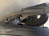 a close up of a motor bike with a green handle