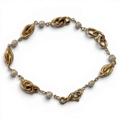 a close up of a bracelet on a white background