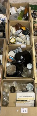 boxes filled with assorted items sit on the floor in a room