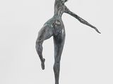 statue of a female dancer on a marble base on a white background