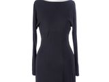 a black dress on a mannequin stand with a white background