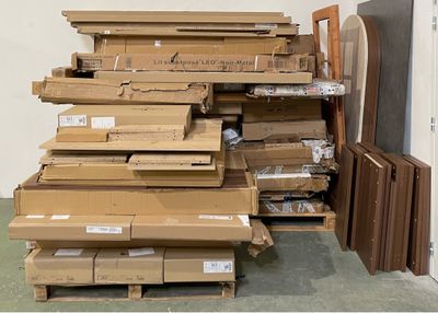 a large pile of cardboard boxes stacked on top of each other