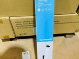 a cardboard box with a sticker on it sitting on the floor