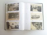 an open book with pictures of buildings on it