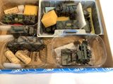 a box filled with assorted toy military vehicles