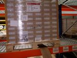 a pallet with a large box on it in a warehouse