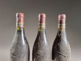 three bottles of wine sitting next to each other on a table