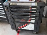 a workbench with many tools on it in a garage