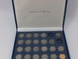an image of a box of coins sitting on top of a table