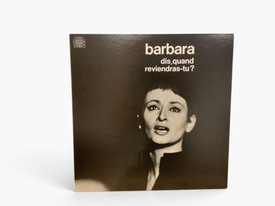 a black and white photo of a woman ' s face with the words barbara on it