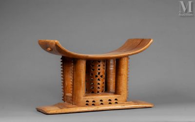 an image of a wooden stool with a carved design on top of it