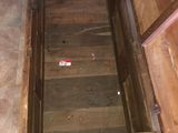a wooden box that is open on the floor