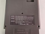 a black electronic device on a white surface