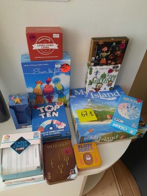 a lot of books and games on the table