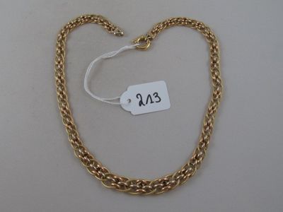 a close up of a gold chain with a tag on it