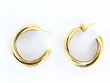 a pair of gold hoop earrings on a white background