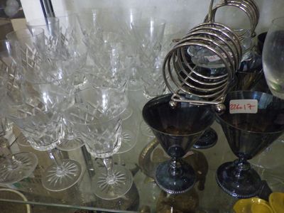 a glass table with a lot of wine glasses on it