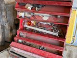 a red tool box with tools on top of it