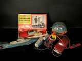 a toy submarine and a box of electronics on a table