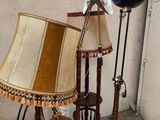 a lamp that is next to a table with a lamp on top of it