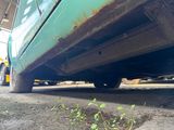 a close up view of a car ' s tire on the ground