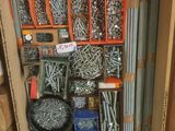 a box with many different types of screws in it