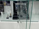 a glass display case with a lot of watches on it