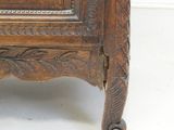 a wooden cabinet with a door on the top of it