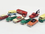 a lot of toy cars that are on a white surface